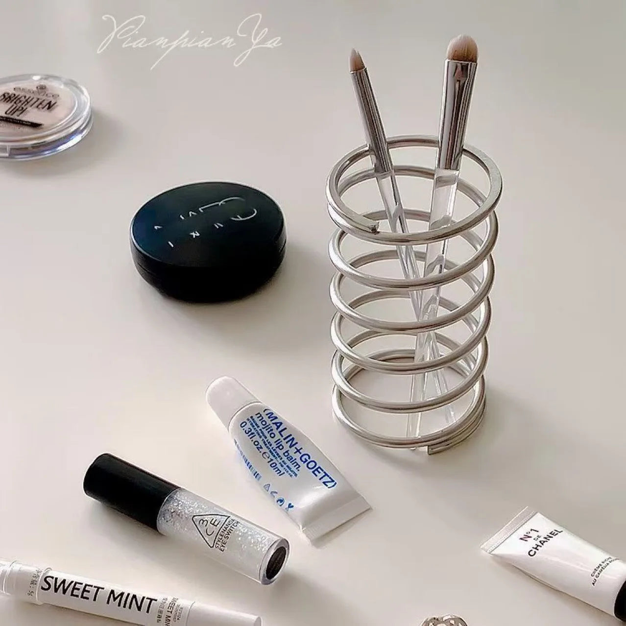 Spring Toothbrush holder