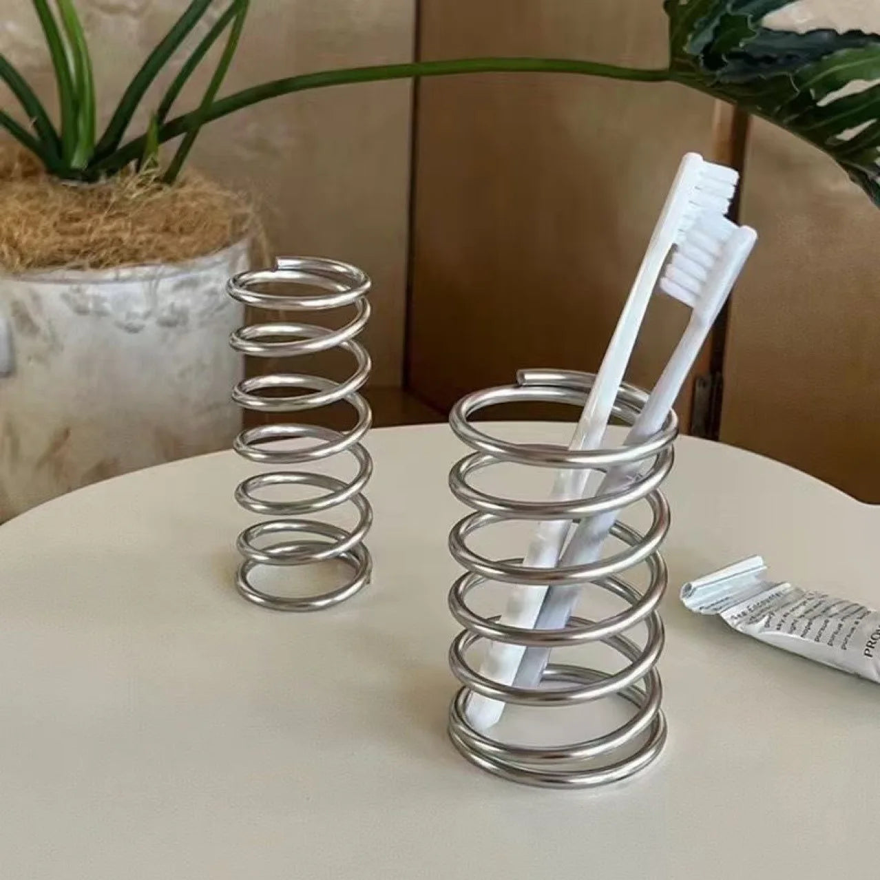 Spring Toothbrush holder