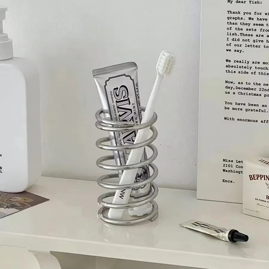Spring Toothbrush holder